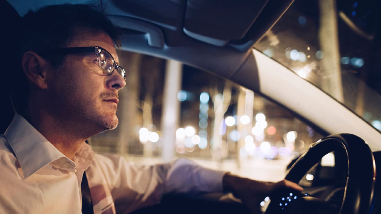 drivingatnight_main Man driving a car at night