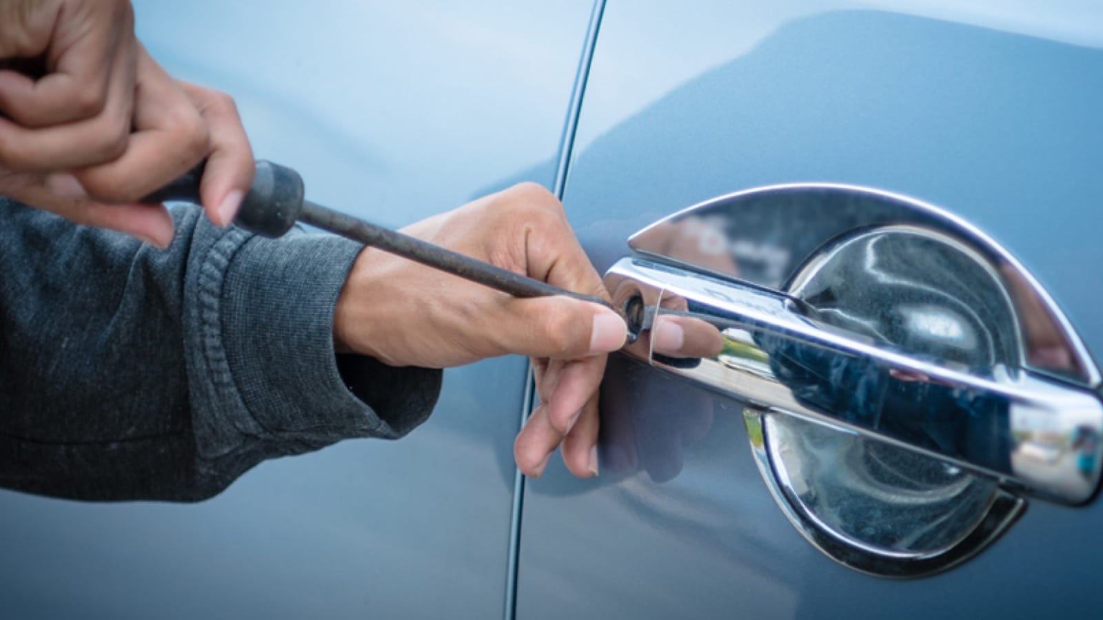 stolen-car-large Thief breaking into car