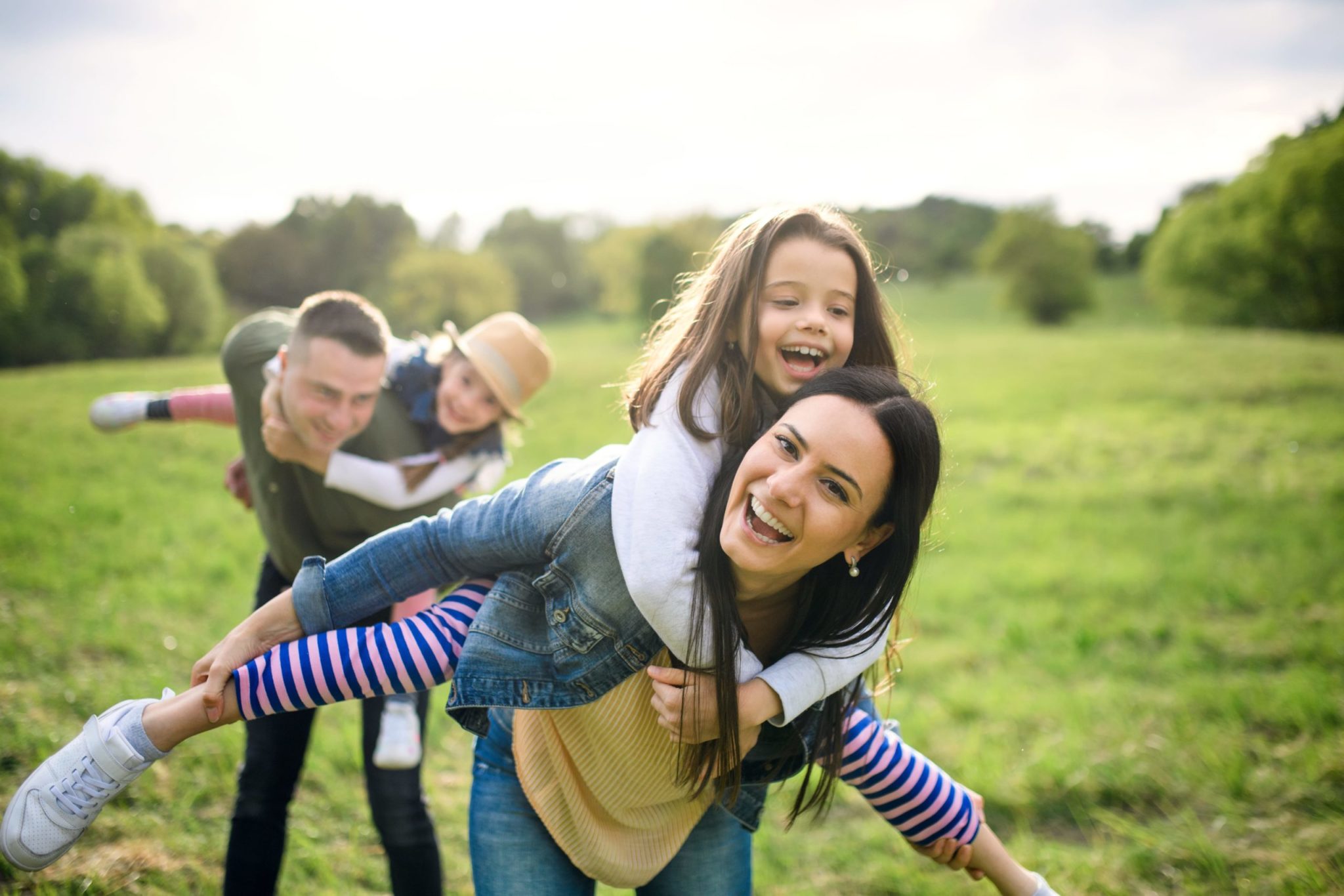 GettyImages-1250031442 Happy Family Having Fun With Two Daughters