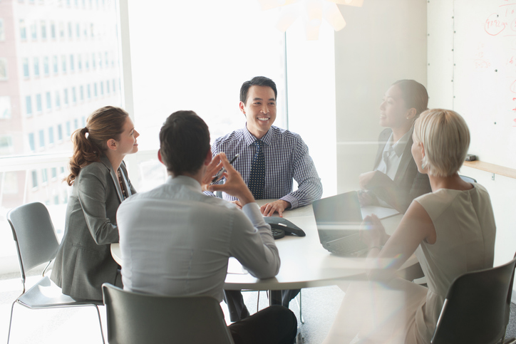 Business people talking in meeting Business Colleagues Having a Meeting In a Boardroom