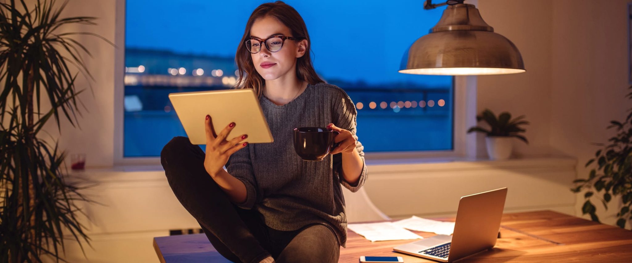 How to Reward Employees for Overtime Work Young Woman Working at Home Late at Night