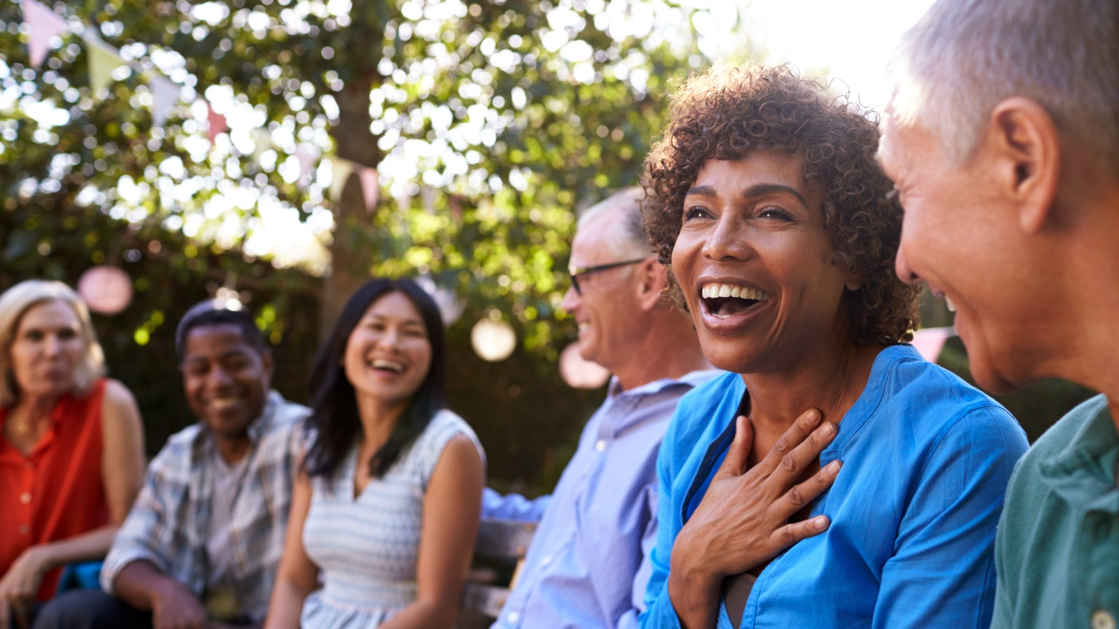 woman laughing with friends mature friends hanging together