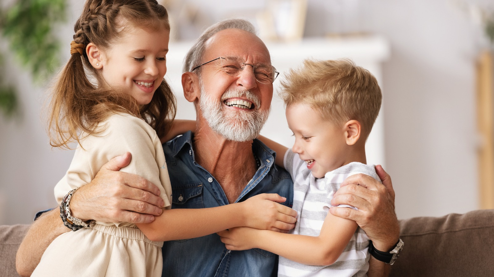 senior man with kids smiling Grandfather and his grandkids