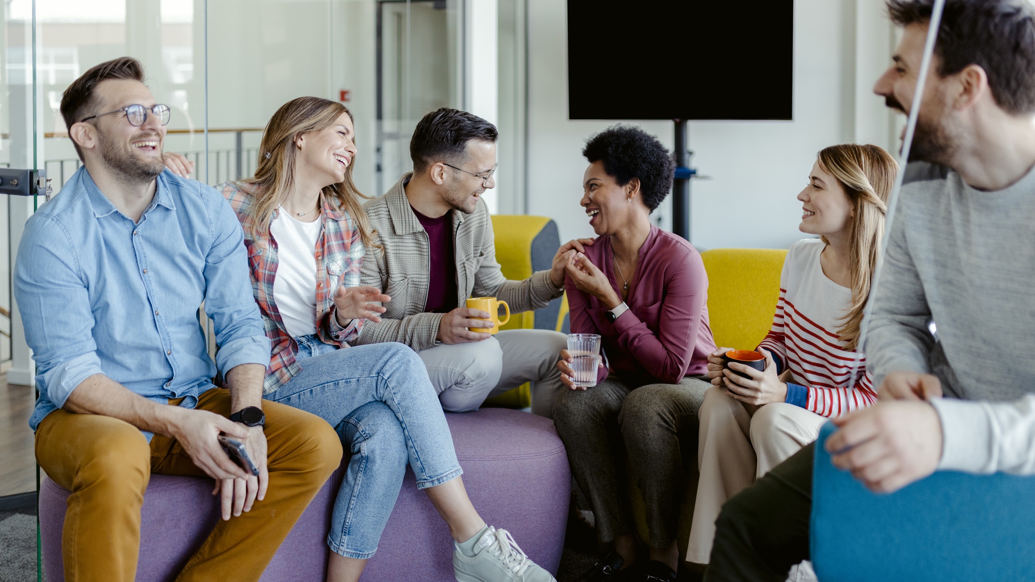 Employees enjoying each other Employees in modern chill room