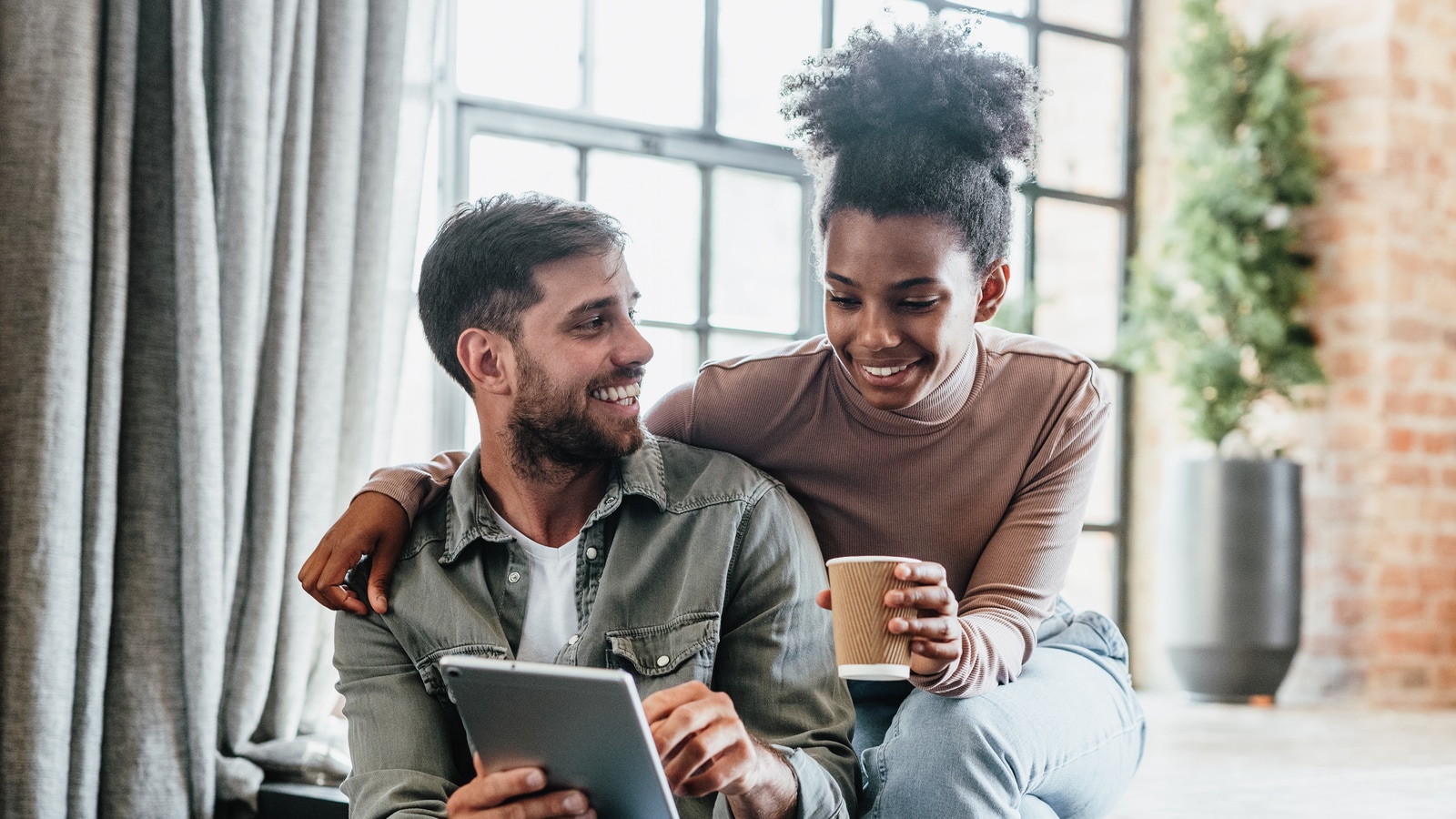 convertible life insurance young couple looking at ipad